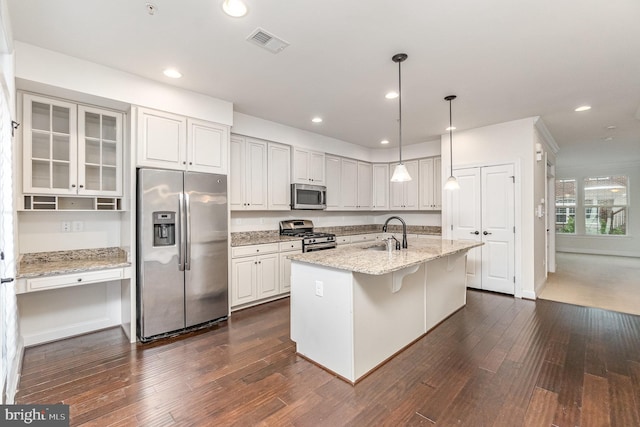 1427 Chanery Ct, Odenton, MD 21113 - kitchen with stainless steel appliances, dark wood-type flooring, a sink, a center island with sink, and light stone counters