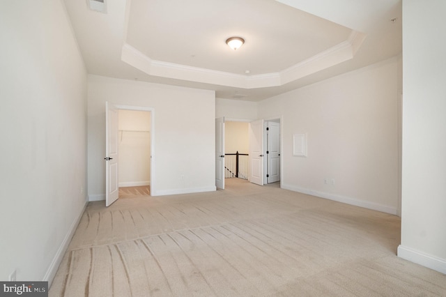 1427 Chanery Ct, Odenton, MD 21113 - unfurnished bedroom with a tray ceiling, light colored carpet, crown molding, baseboards, and a spacious closet