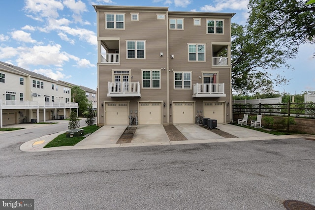 1427 Chanery Ct, Odenton, MD 21113 - view of building exterior featuring central AC, fence, an attached garage, driveway, and a residential view