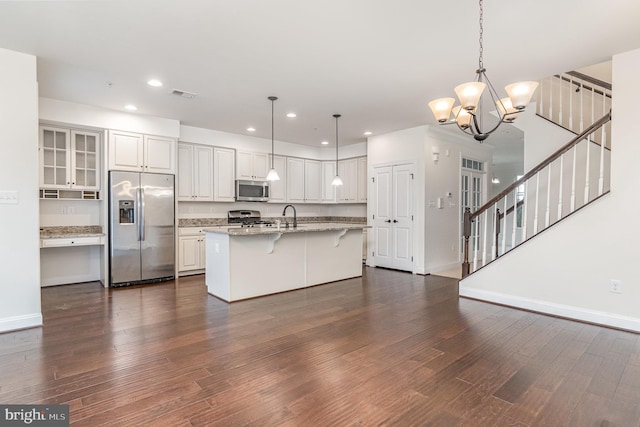 1427 Chanery Ct, Odenton, MD 21113 - kitchen featuring appliances with stainless steel finishes, dark wood-type flooring, baseboards, a breakfast bar, and recessed lighting