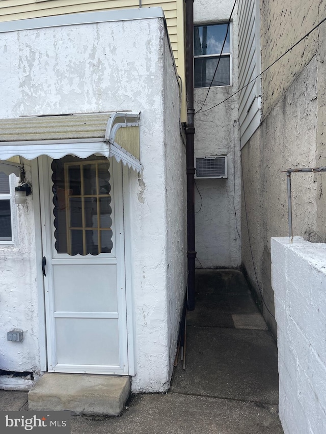 view of side of property with stucco siding