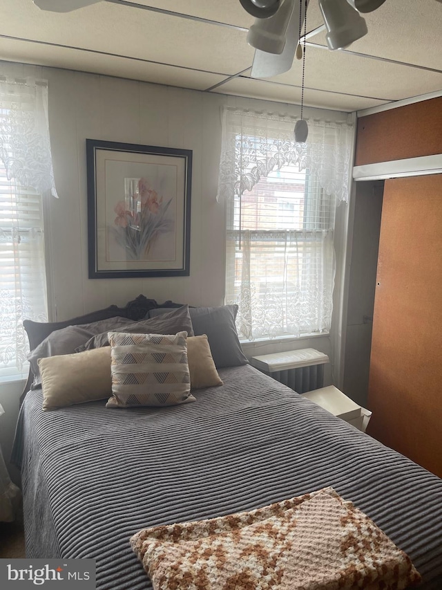 bedroom with multiple windows