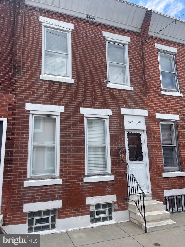 multi unit property with entry steps and brick siding