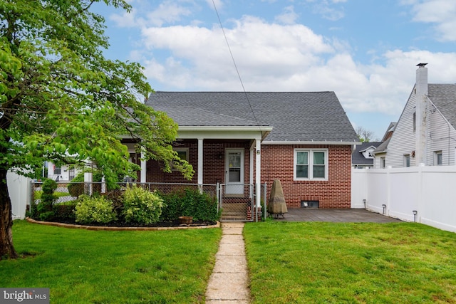 527 Eshelman St, Highspire, PA 17034 - bungalow-style home with brick siding, roof with shingles, and a gate