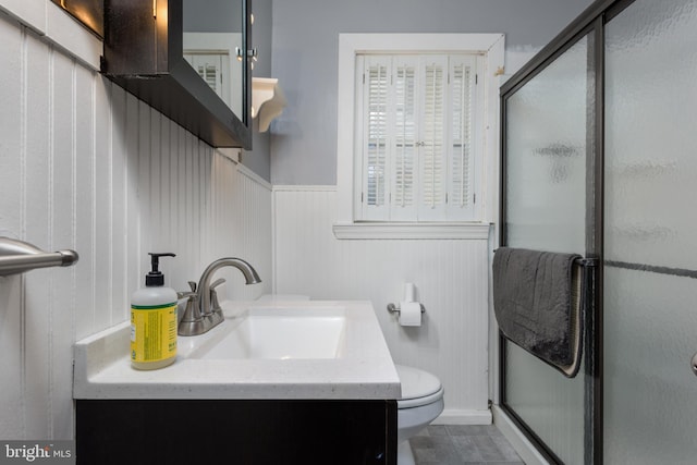 527 Eshelman St, Highspire, PA 17034 - full bathroom featuring a shower stall, a wainscoted wall, toilet, vanity, and baseboards