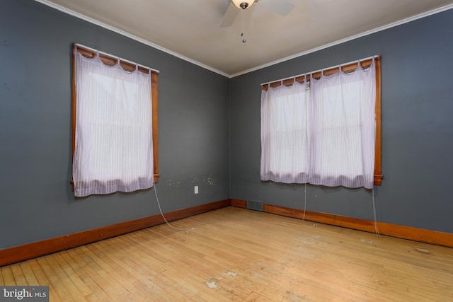 527 Eshelman St, Highspire, PA 17034 - spare room featuring ornamental molding, a ceiling fan, hardwood / wood-style flooring, and baseboards