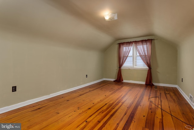 527 Eshelman St, Highspire, PA 17034 - bonus room featuring hardwood / wood-style flooring, vaulted ceiling, and baseboards