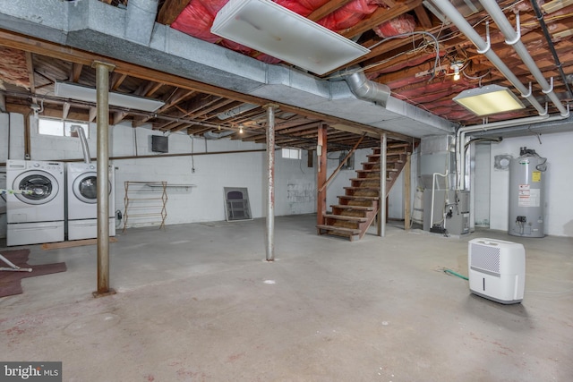 527 Eshelman St, Highspire, PA 17034 - unfinished below grade area with water heater, washing machine and dryer, stairway, heating unit, and concrete block wall