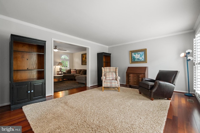 11680 Pellow Circle Ct, Herndon, VA 20170 - sitting room featuring crown molding, dark wood-style flooring, baseboards, and a ceiling fan