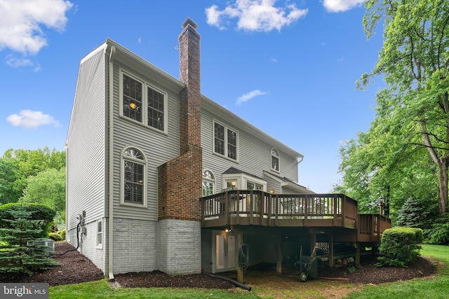 11680 Pellow Circle Ct, Herndon, VA 20170 - rear view of house with a chimney, a wooden deck, and cooling unit