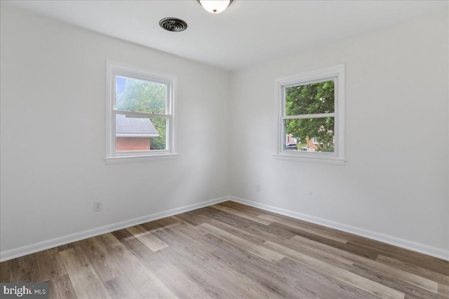 12 Montague Cir, Winchester, VA 22601 - empty room with healthy amount of natural light, wood finished floors, and baseboards