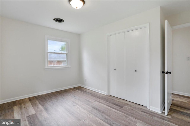 12 Montague Cir, Winchester, VA 22601 - unfurnished bedroom featuring a closet, wood finished floors, and baseboards