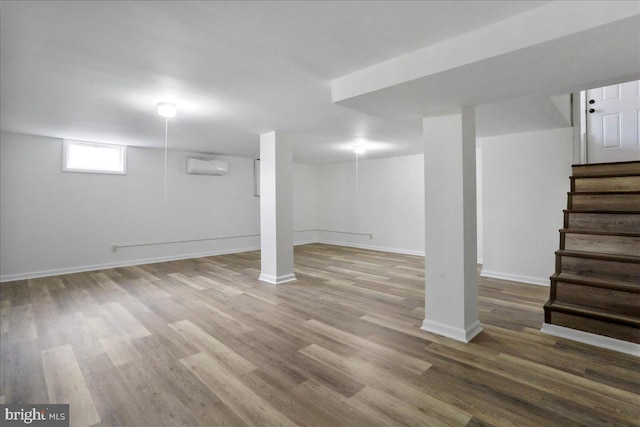 12 Montague Cir, Winchester, VA 22601 - below grade area with an AC wall unit, wood finished floors, stairway, and baseboards