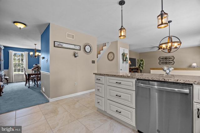 kitchen with a chandelier, stainless steel dishwasher, light stone counters, and white cabinets