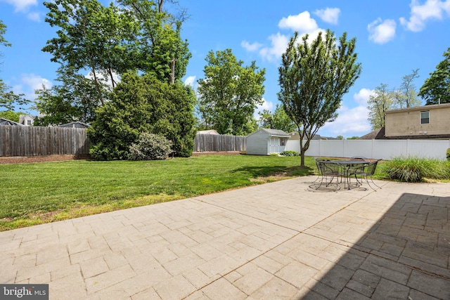 view of patio featuring an outdoor structure and a storage shed