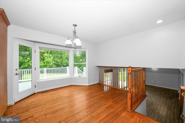 4211 Springview, Jefferson, MD 21755 - spare room with a chandelier, wood finished floors, and baseboards