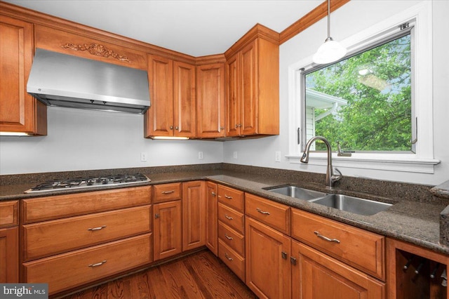 4211 Springview, Jefferson, MD 21755 - kitchen featuring wall chimney range hood, gas cooktop, a sink, brown cabinetry, and dark wood-style floors