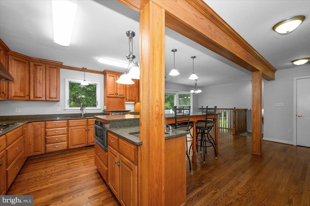 4211 Springview, Jefferson, MD 21755 - kitchen with a sink, healthy amount of natural light, wood finished floors, stainless steel gas cooktop, and beamed ceiling