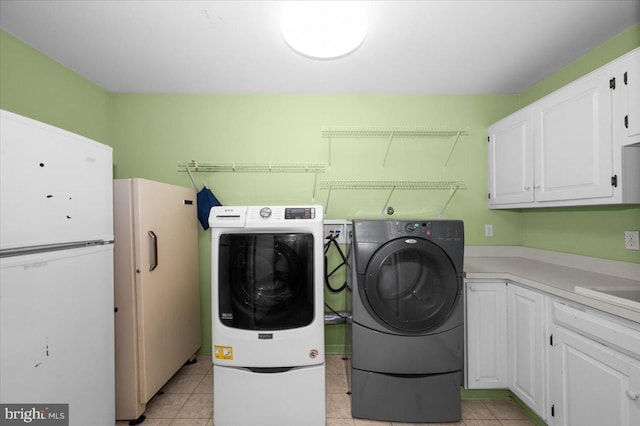4211 Springview, Jefferson, MD 21755 - laundry area with cabinet space, washing machine and dryer, and light tile patterned floors