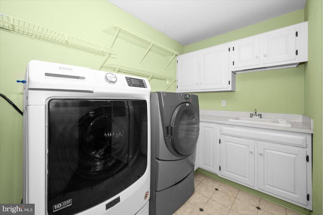 4211 Springview, Jefferson, MD 21755 - laundry area featuring washing machine and dryer, light tile patterned floors, and cabinet space