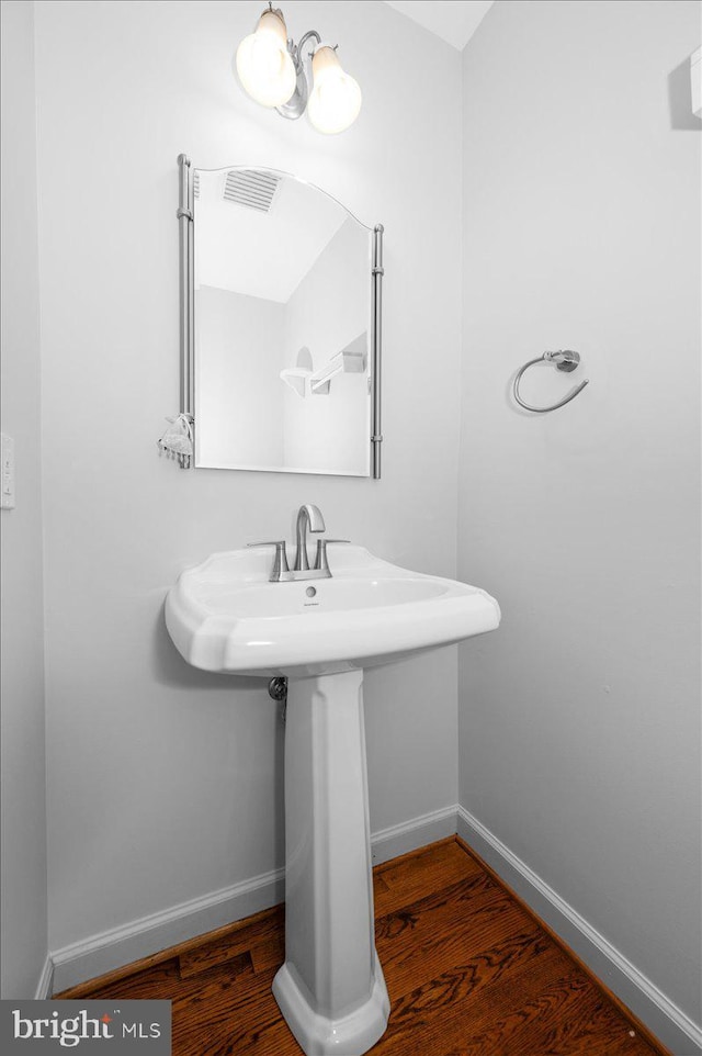 4211 Springview, Jefferson, MD 21755 - bathroom featuring wood finished floors, baseboards, and a sink