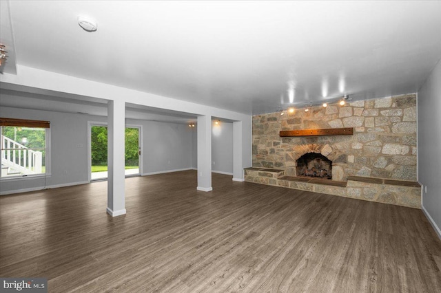 4211 Springview, Jefferson, MD 21755 - unfurnished living room with a stone fireplace, wood finished floors, and baseboards