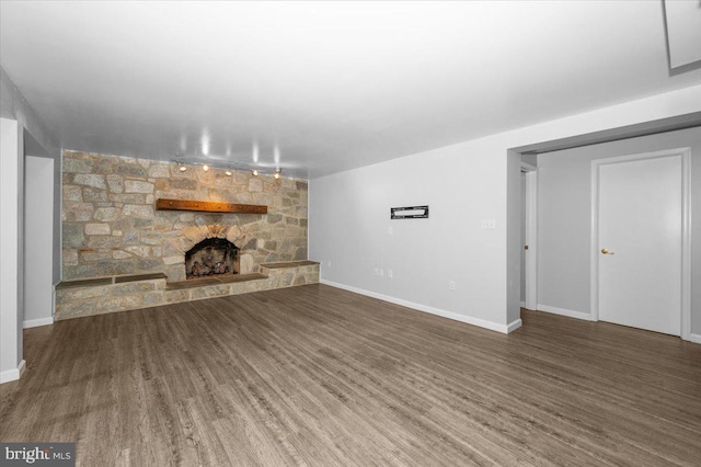 4211 Springview, Jefferson, MD 21755 - unfurnished living room featuring wood finished floors, a stone fireplace, and baseboards