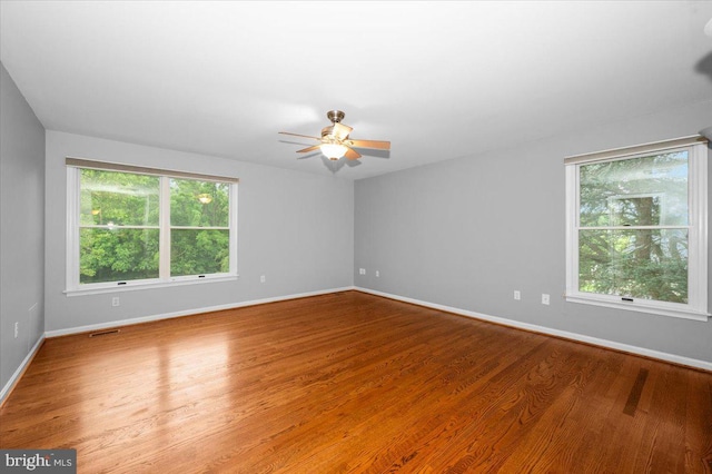 4211 Springview, Jefferson, MD 21755 - unfurnished room with plenty of natural light, baseboards, ceiling fan, and wood finished floors