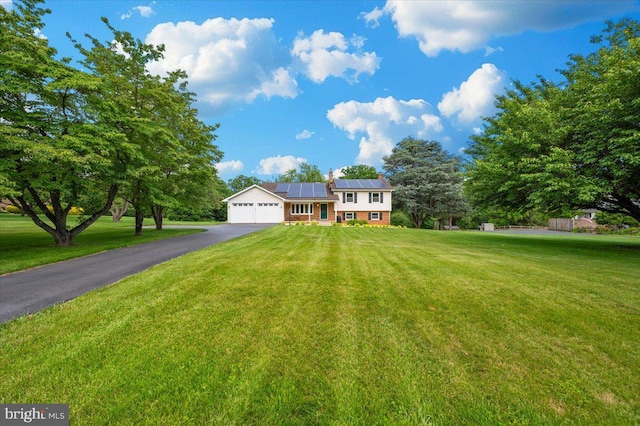 4211 Springview, Jefferson, MD 21755 - tri-level home with driveway, solar panels, a front yard, and a garage