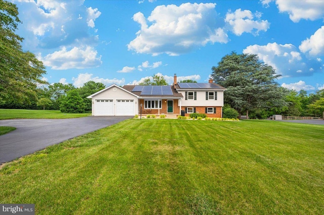 4211 Springview, Jefferson, MD 21755 - split level home featuring brick siding, asphalt driveway, an attached garage, and a front lawn