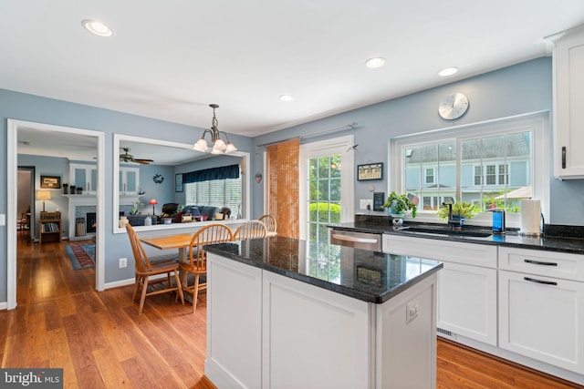 12702 Purdham Dr, Woodbridge, VA 22192 - kitchen with a sink, dishwasher, white cabinets, a center island, and recessed lighting