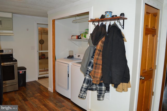 clothes washing area with separate washer and dryer and dark wood-style flooring
