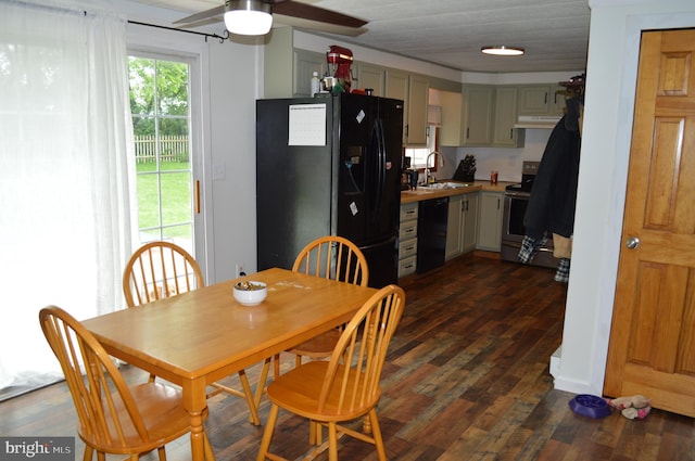 dining room with a ceiling fan and dark wood-type flooring