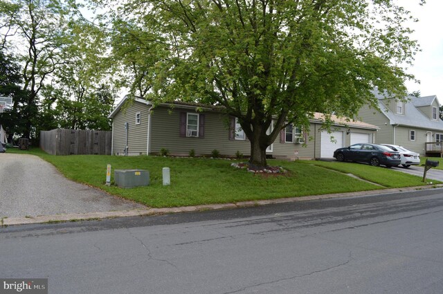 view of front of house with driveway and a garage
