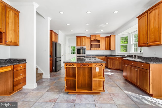 kitchen featuring open shelves, appliances with stainless steel finishes, dark stone counters, brown cabinetry, and recessed lighting