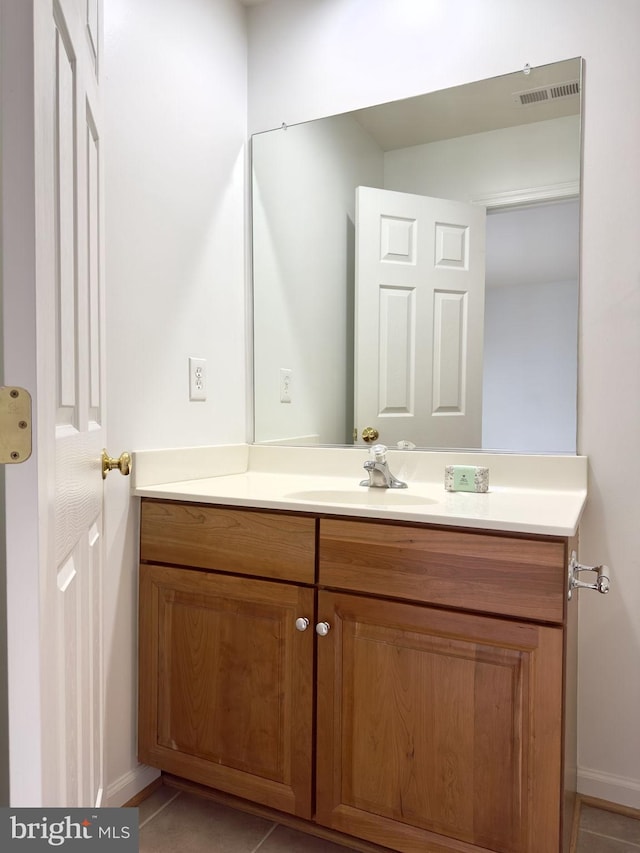 bathroom featuring vanity and baseboards
