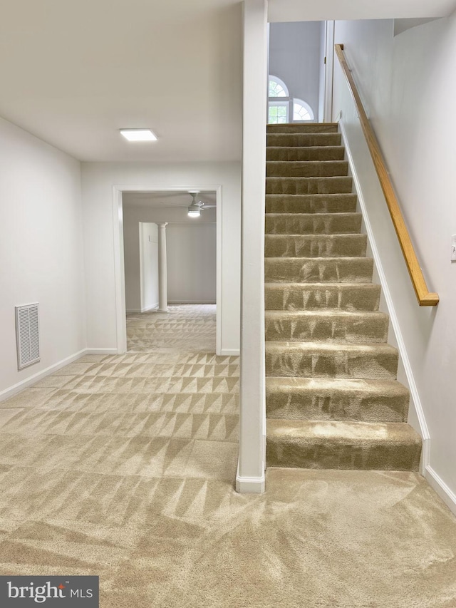 staircase with carpet and baseboards