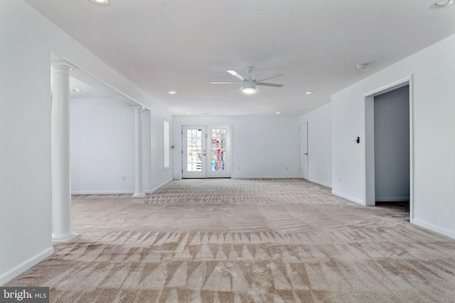spare room featuring carpet flooring, ornate columns, a ceiling fan, baseboards, and recessed lighting