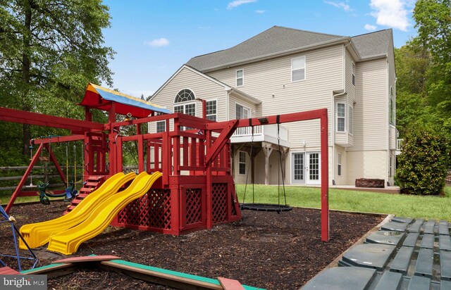 view of playground featuring a deck and a yard
