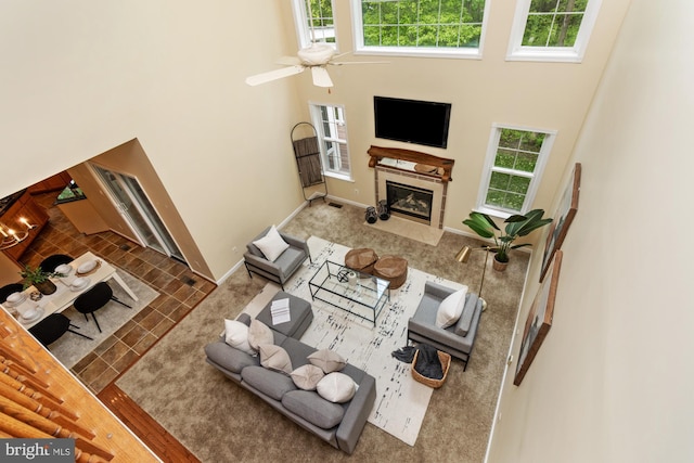 2200 Exeter Ct, Fallston, MD 21047 - living area featuring a tile fireplace, a high ceiling, baseboards, and ceiling fan