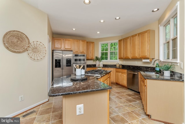 2200 Exeter Ct, Fallston, MD 21047 - kitchen with appliances with stainless steel finishes, a sink, a kitchen island, recessed lighting, and dark stone counters