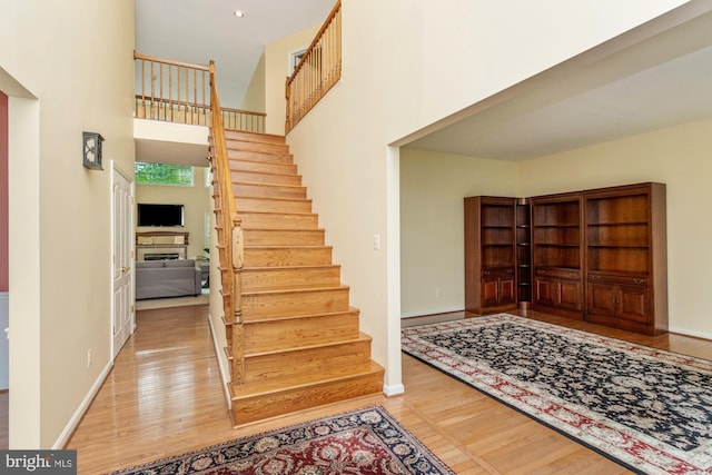 2200 Exeter Ct, Fallston, MD 21047 - foyer entrance featuring wood finished floors, stairs, a high ceiling, and baseboards