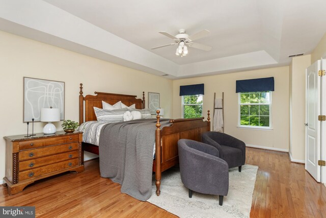 2200 Exeter Ct, Fallston, MD 21047 - bedroom with a tray ceiling, wood finished floors, and a ceiling fan
