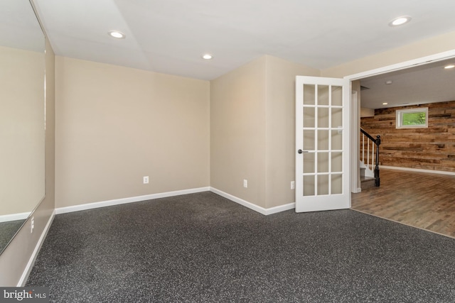 2200 Exeter Ct, Fallston, MD 21047 - unfurnished room with wood walls, baseboards, recessed lighting, and stairs