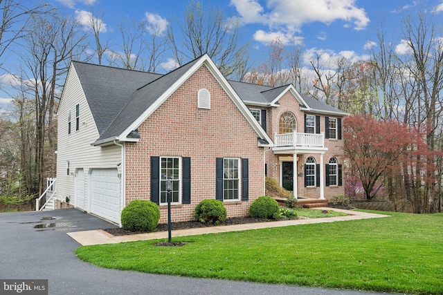 2200 Exeter Ct, Fallston, MD 21047 - view of front of home featuring a balcony, asphalt driveway, brick siding, a garage, and a front lawn