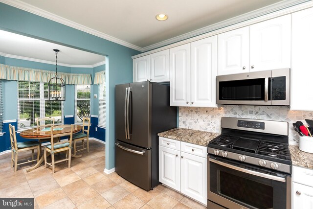 31766 Chablis Ln Unit 76, Lewes, DE 19958 - kitchen featuring appliances with stainless steel finishes, baseboards, a chandelier, crown molding, and light stone countertops