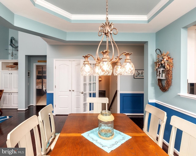 31766 Chablis Ln Unit 76, Lewes, DE 19958 - dining area with a tray ceiling, a chandelier, ornamental molding, and wood finished floors
