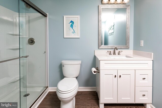 31766 Chablis Ln Unit 76, Lewes, DE 19958 - full bathroom with toilet, vanity, a stall shower, baseboards, and wood finished floors