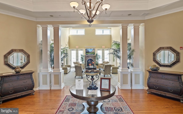 31766 Chablis Ln Unit 76, Lewes, DE 19958 - foyer entrance featuring wood finished floors, healthy amount of natural light, decorative columns, and ornamental molding