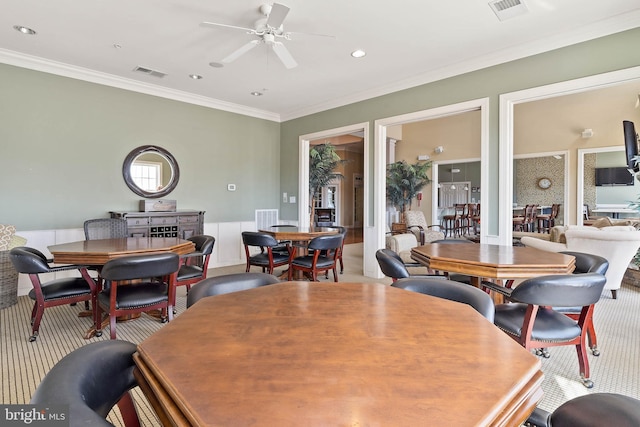 31766 Chablis Ln Unit 76, Lewes, DE 19958 - dining area with ornamental molding, a ceiling fan, and carpet flooring